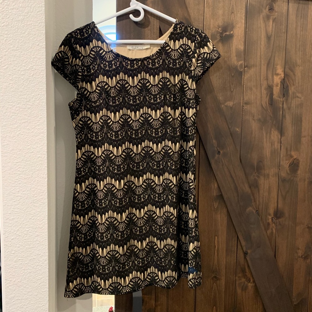 Black lace and nude cocktail dress